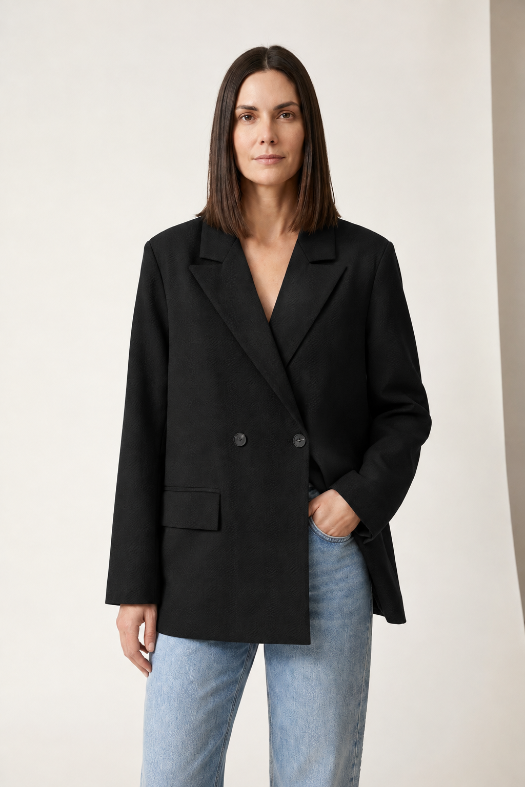 Double-Breasted Tailored Blazer with Peak Lapels in Black, studio shot