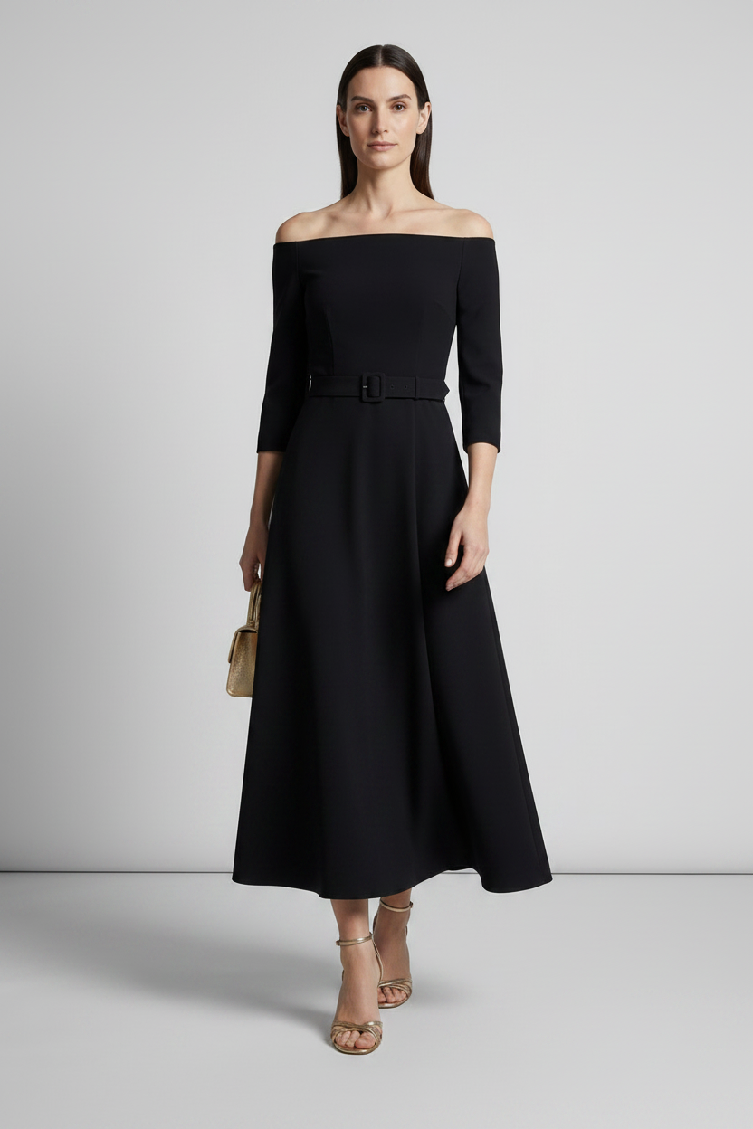 A woman models an off-the-shoulder black midi dress with three-quarter sleeves and a matching black belt at the waist, styled with nude high-heeled sandals and a small beige handbag against a light gray studio background.