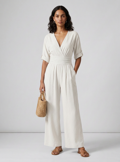 Wide Leg Draped Jumpsuit with V-Neck and Cinched Waist in White, studio shot